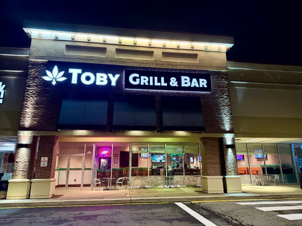 Toby Grill & Bar exterior at night with illuminated signage